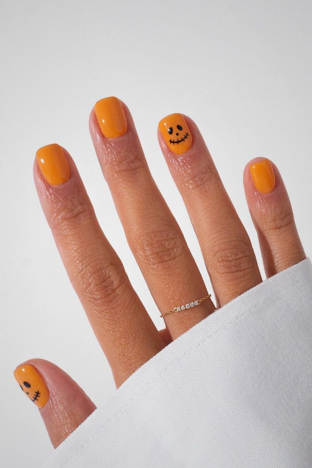 Orange nails with Jack O Lantern face