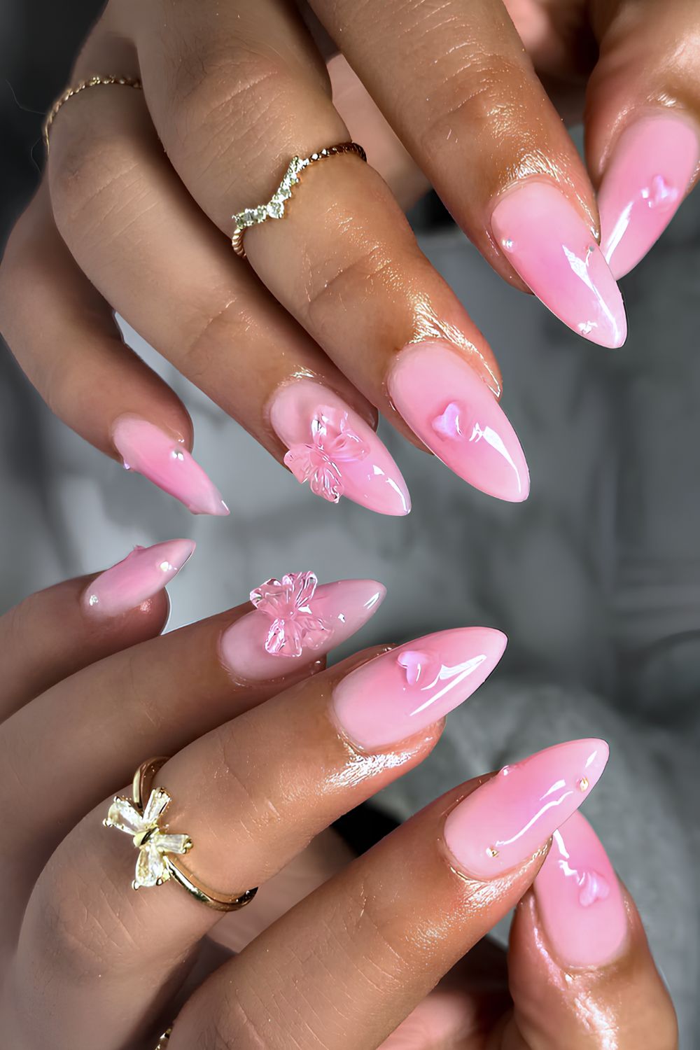 Pink aura nails with textured bows and hearts