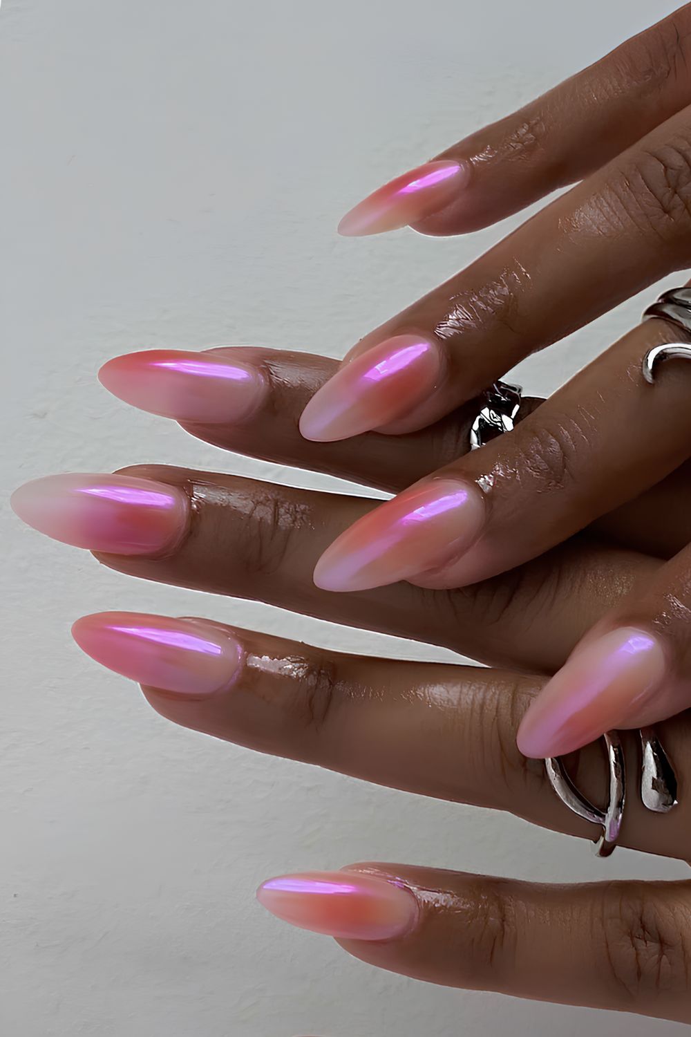 Pink gradient nails with a chrome finish