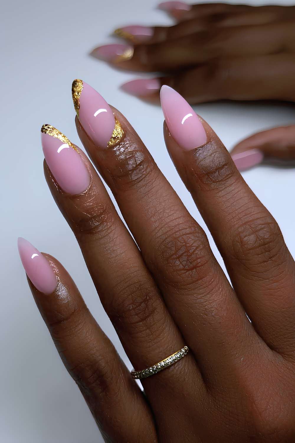 Pink nails with gold foil accents