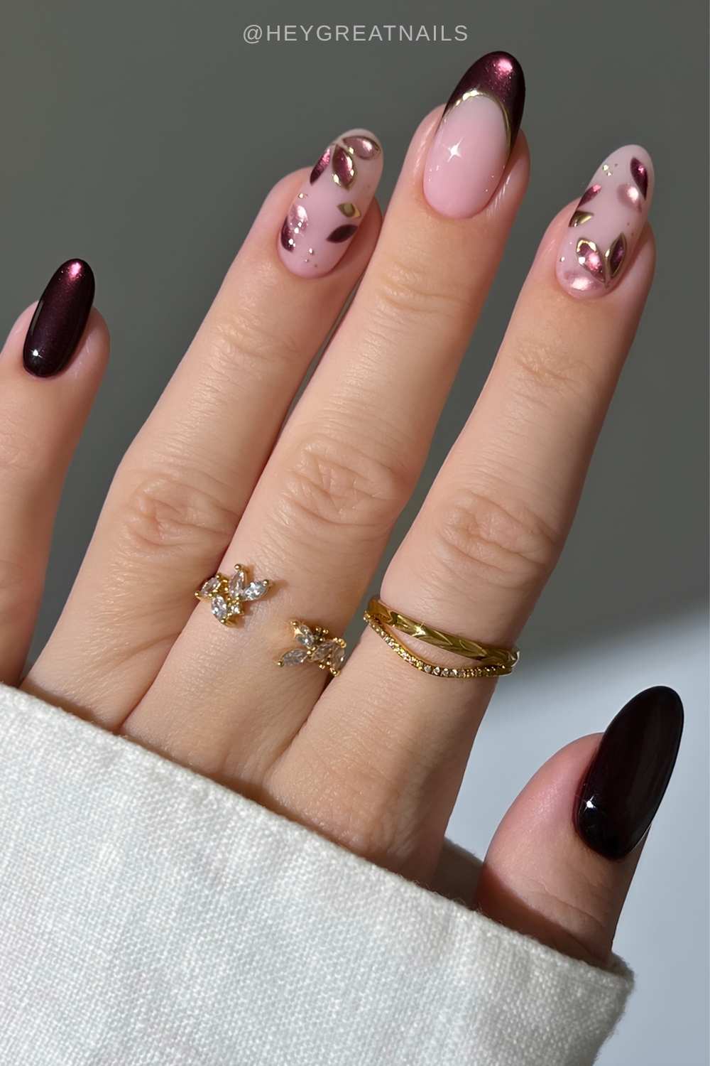 Plum cat eye floral nails