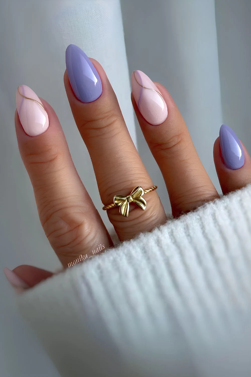 Purple and pink nails with accent swirl art