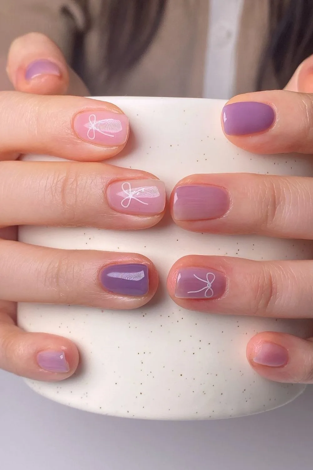 Purple coquette nails with bows