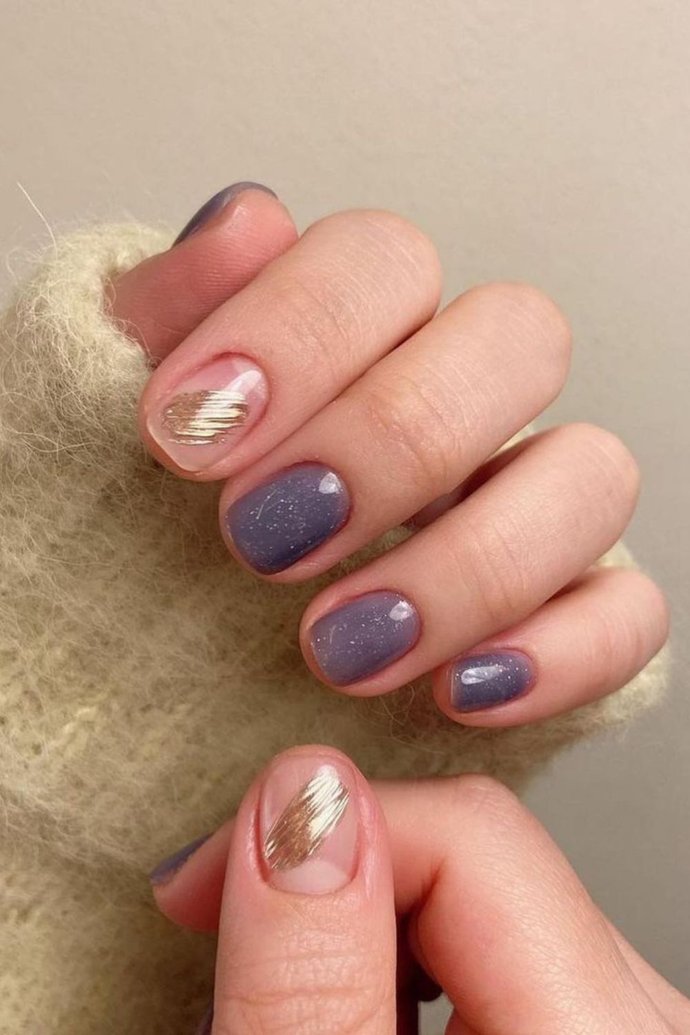 Purple nails with gold accents