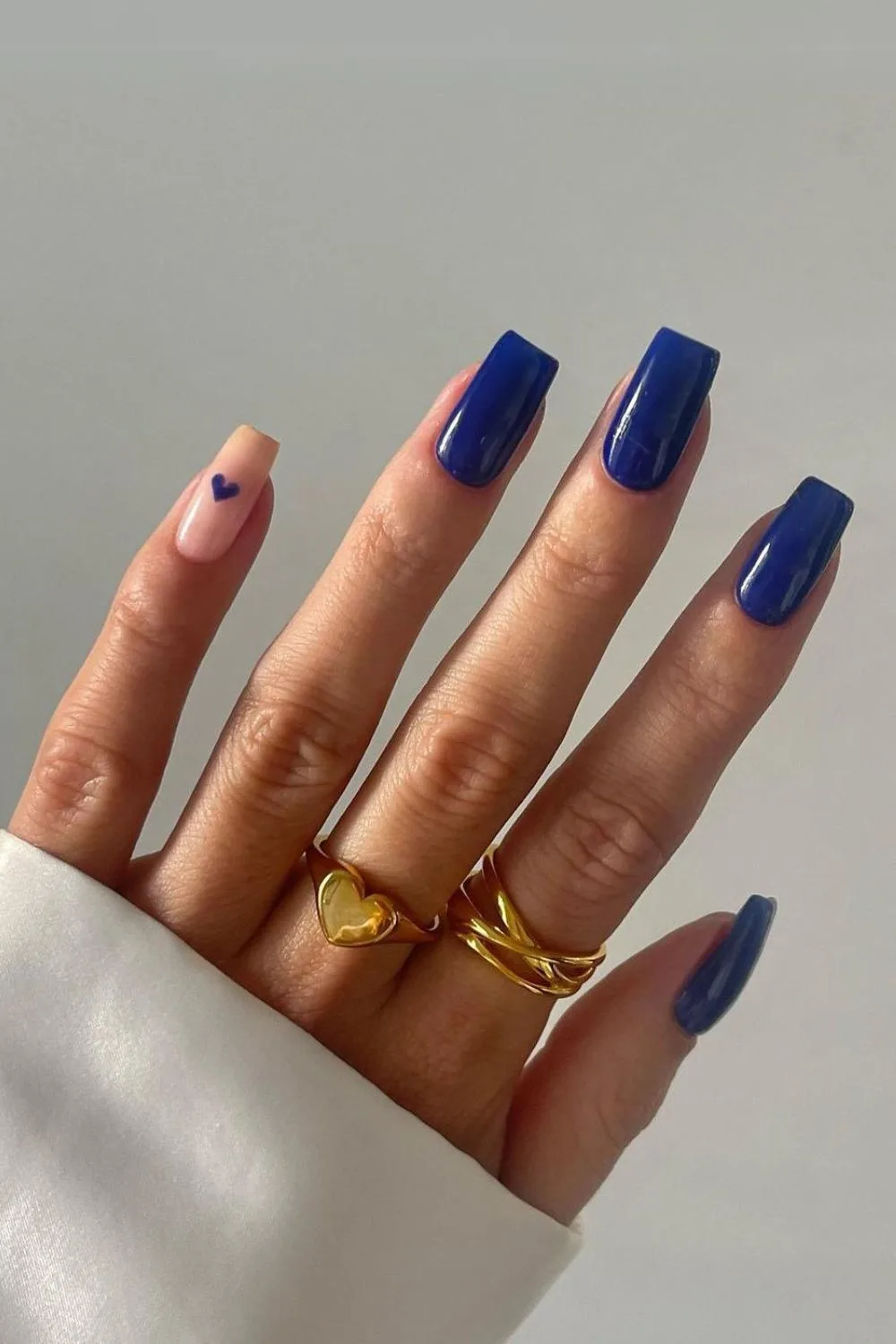 Royal blue mani with an accent heart