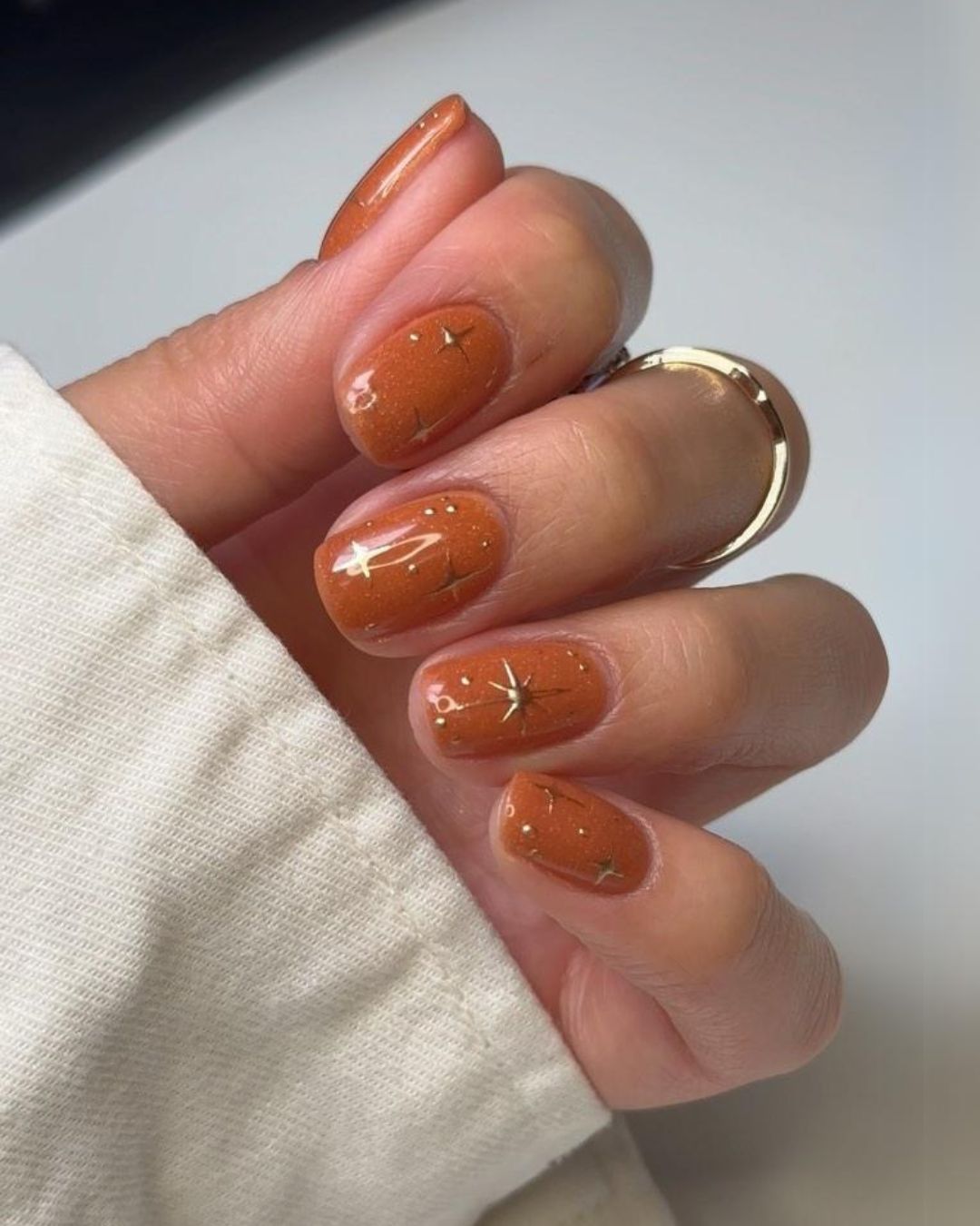 Rusty orange nails with celestial charms