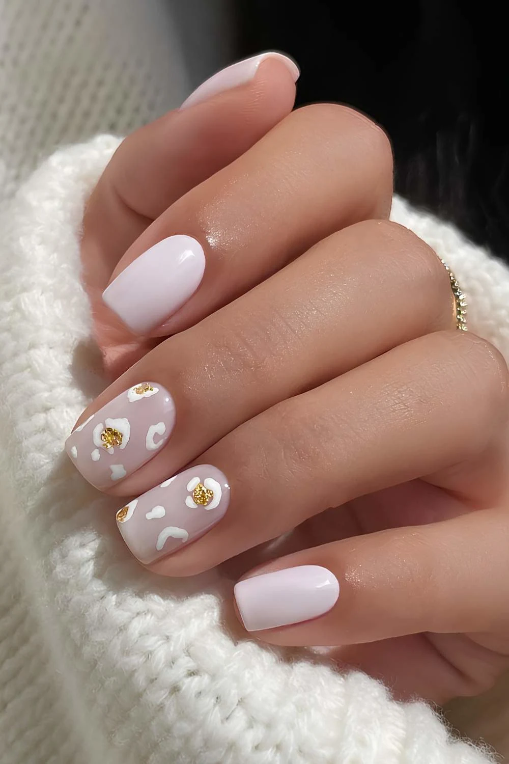 Short white mani with leopard print accent