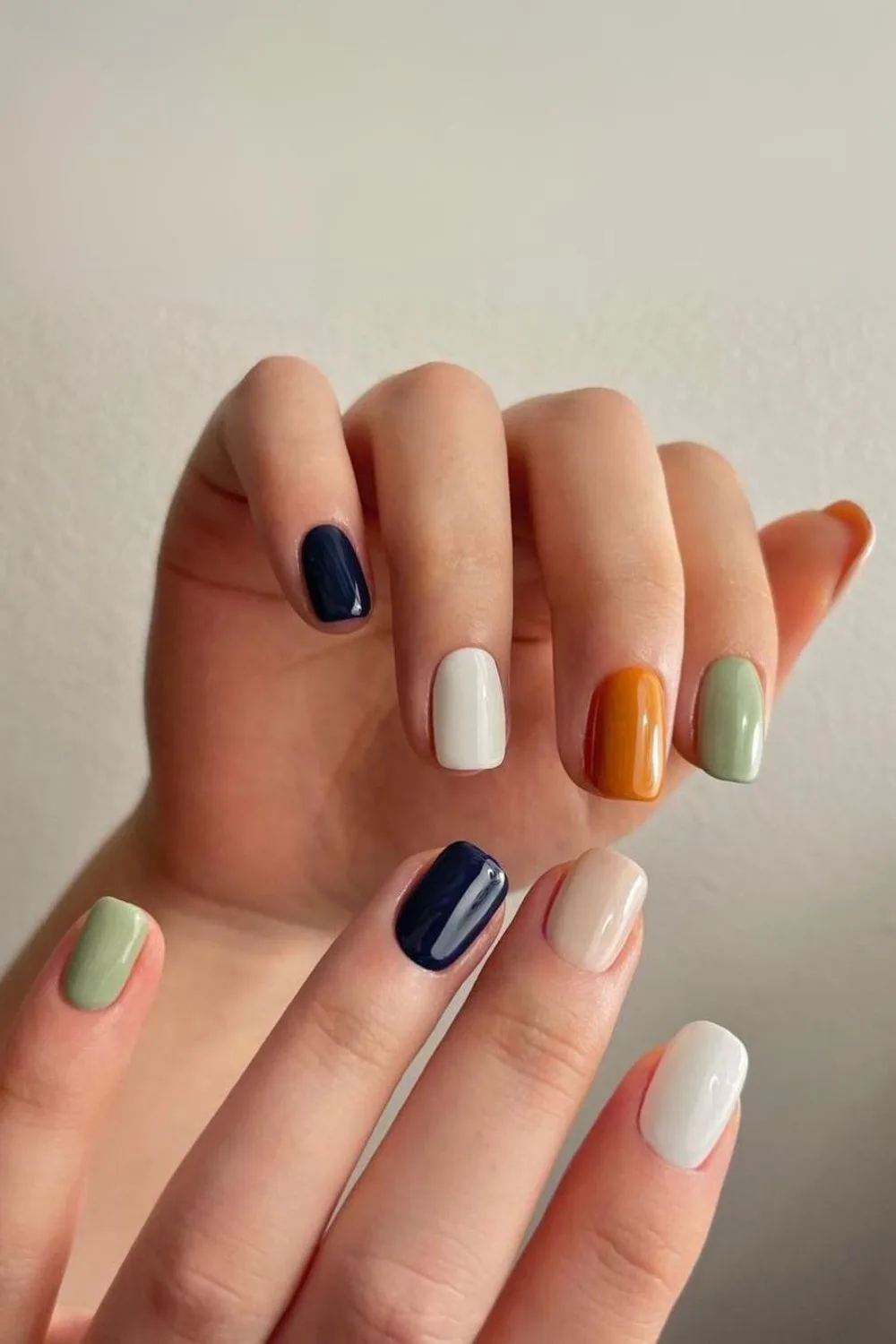 Skittle nails in navy, green, burnt orange and white