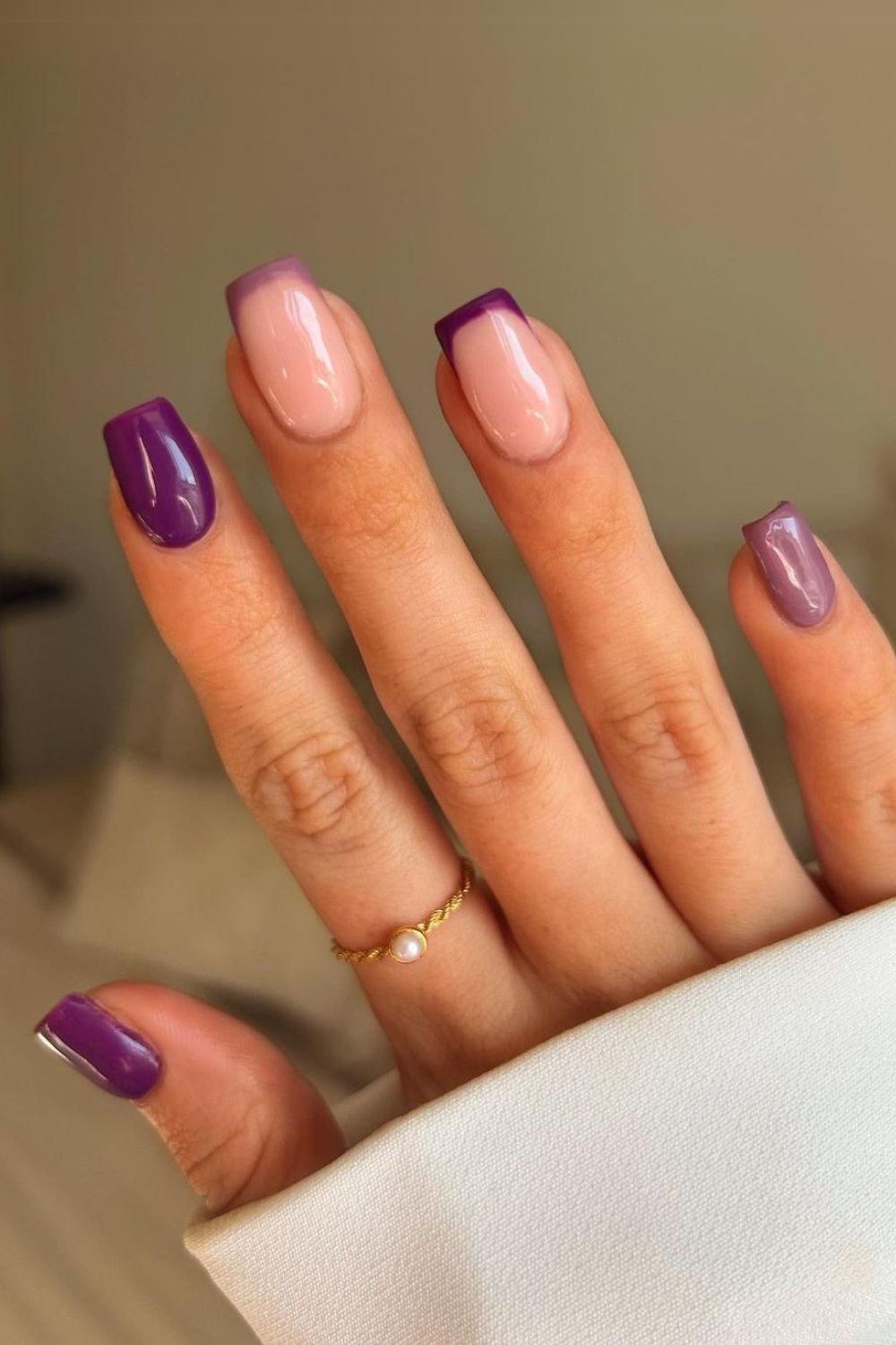 Solid and french tip nails in two shades of purple