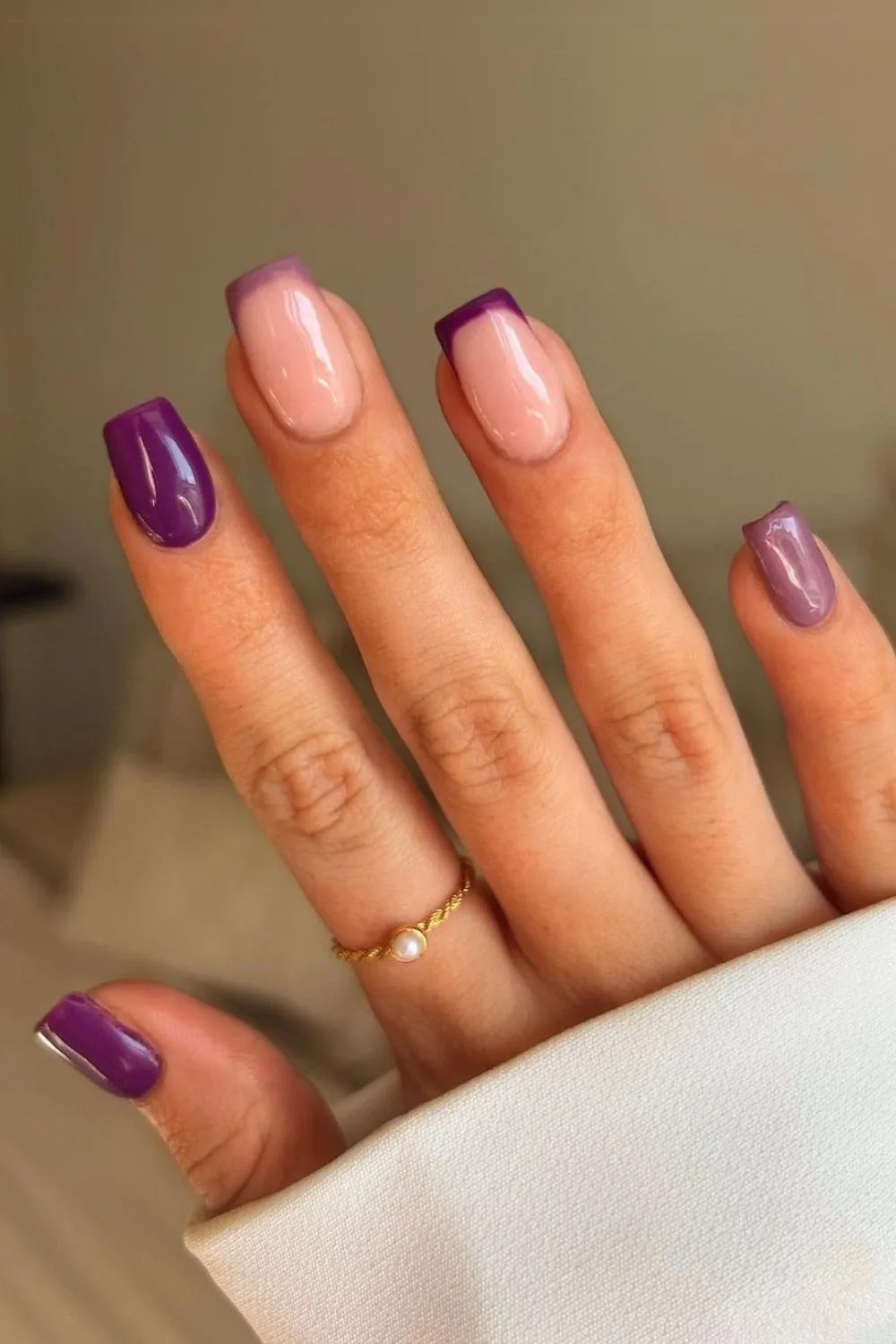 Solid and french tip nails in two shades of purple