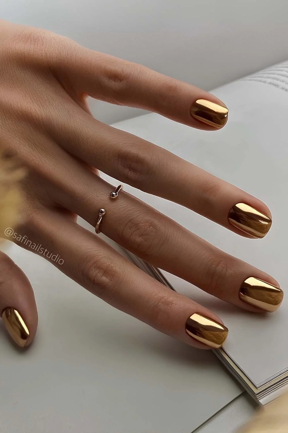 Solid gold chrome manicure