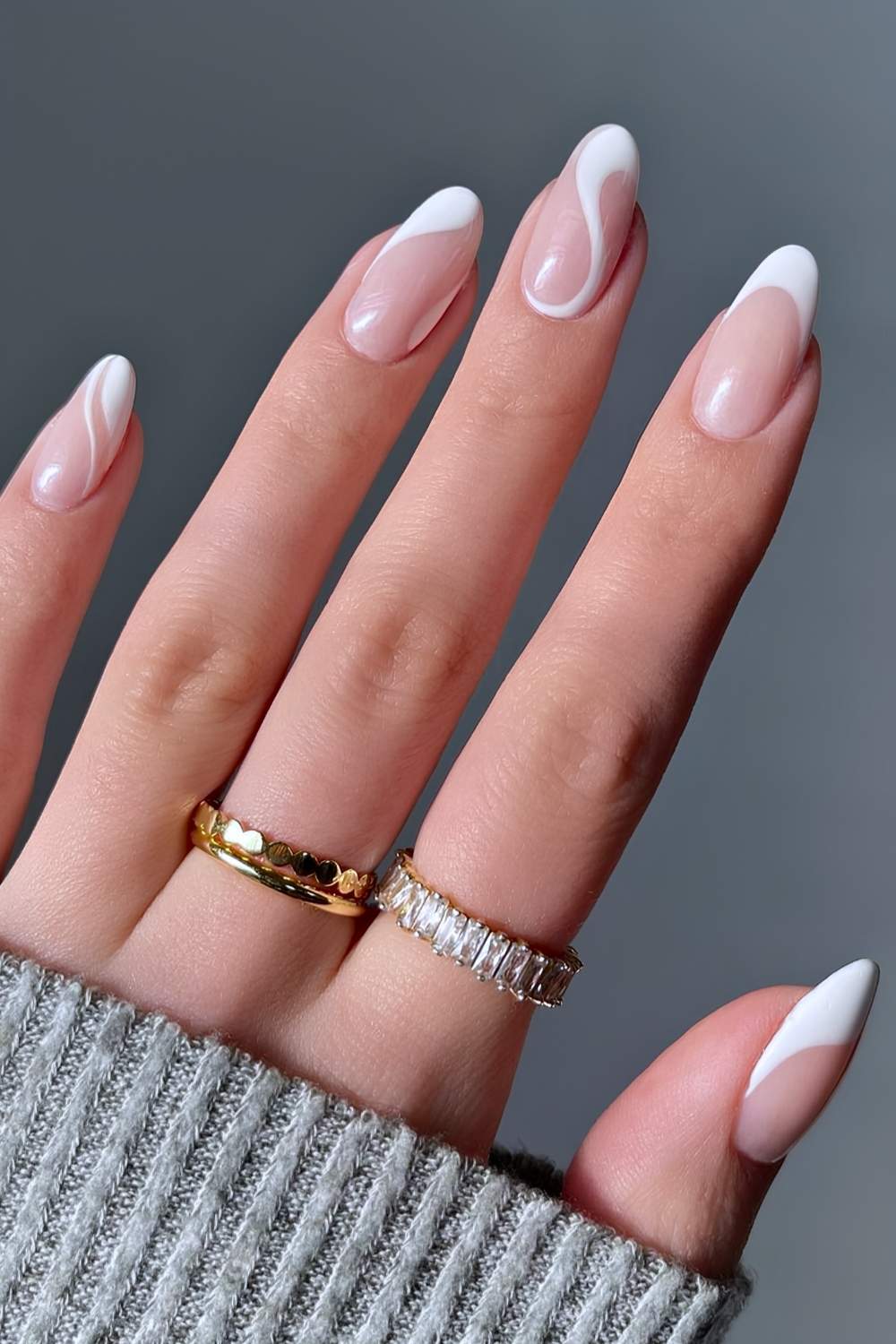 White French tip nails with swirls