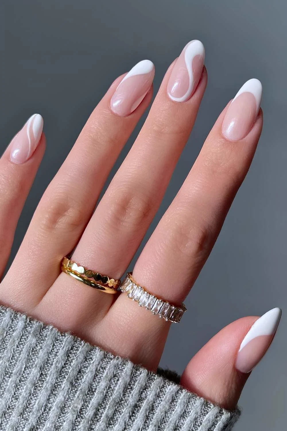 White French tip nails with swirls