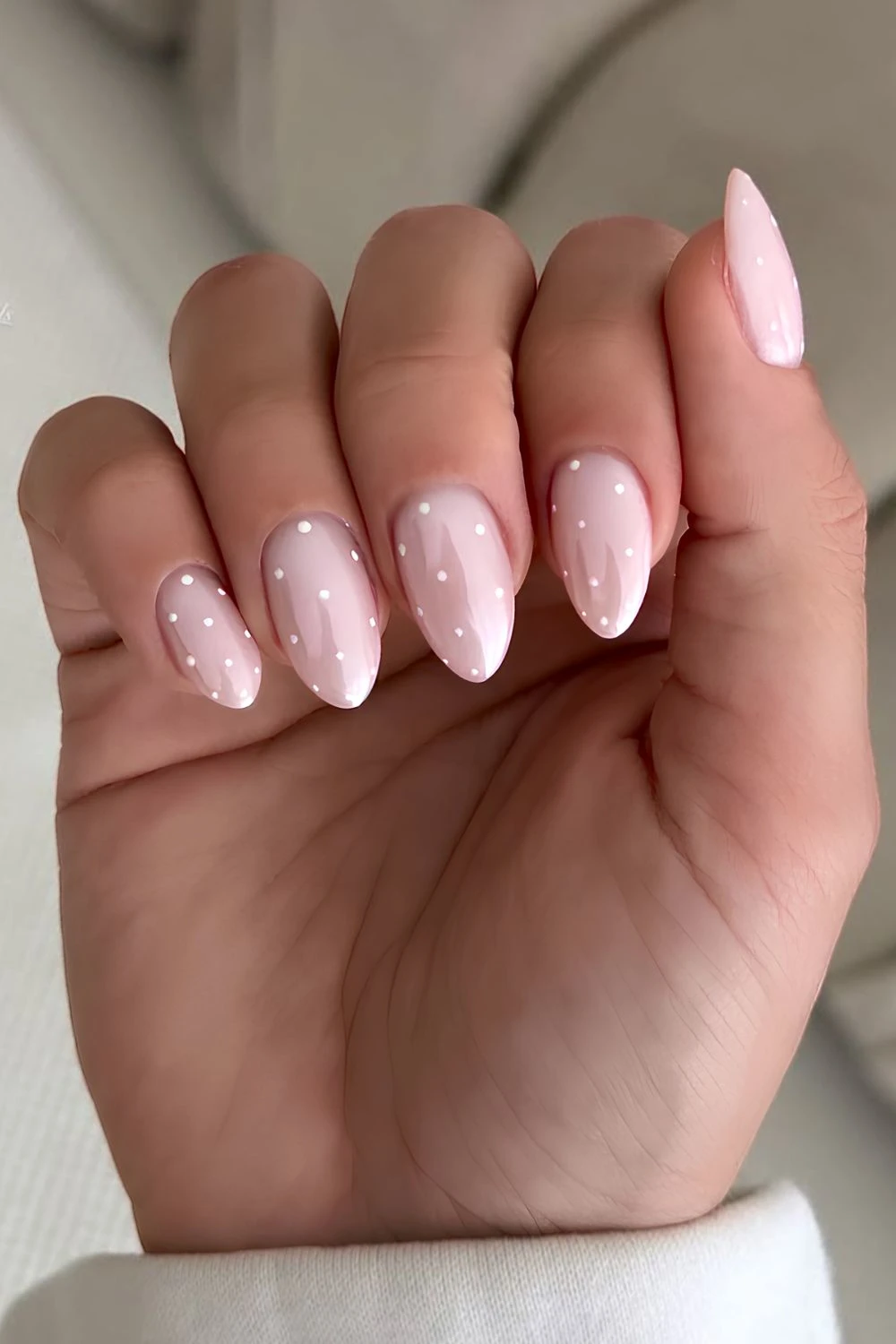 White chrome nails with polka dots