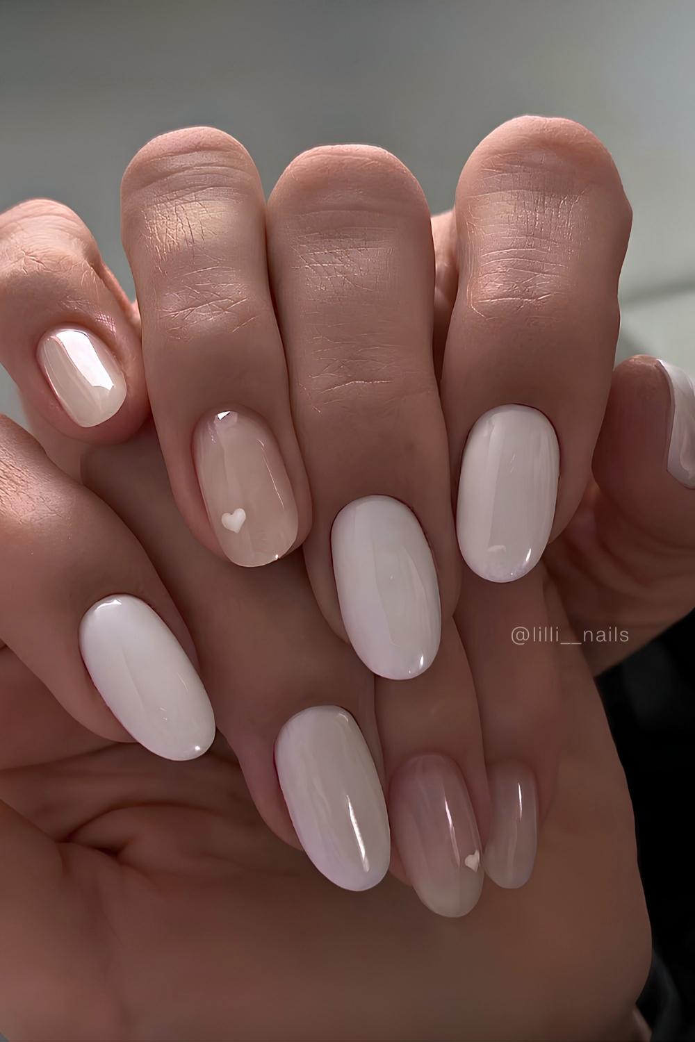 White manicure with minimalist heart art