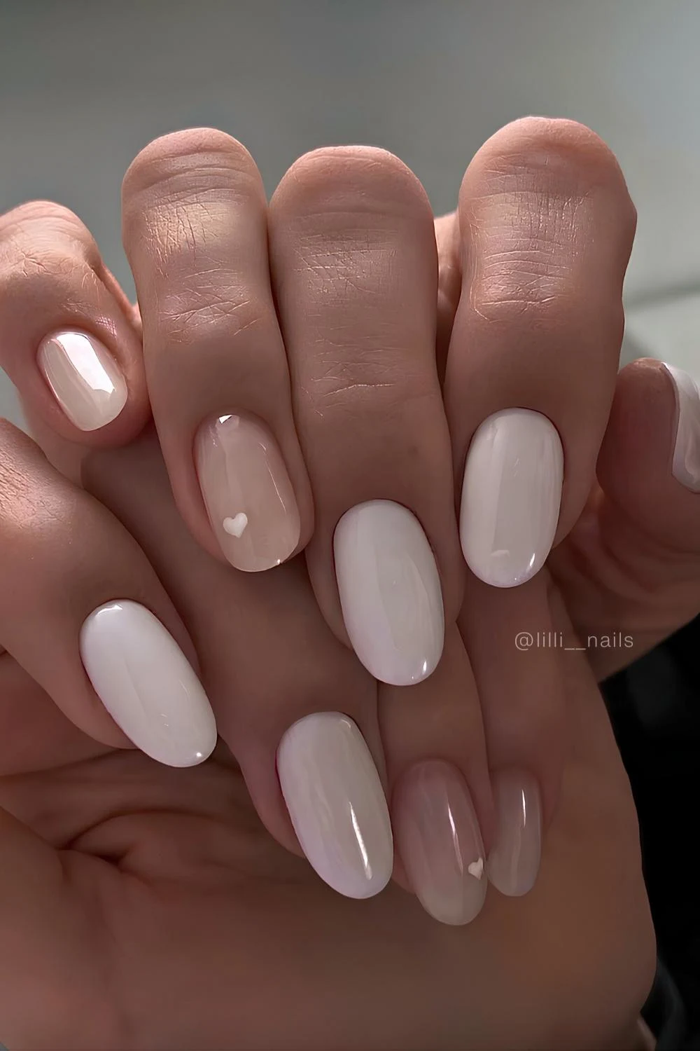 White manicure with minimalist heart art