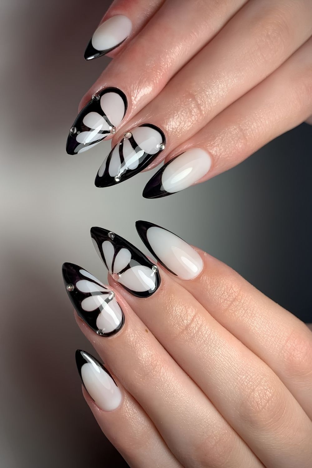 White nails with black butterfly art