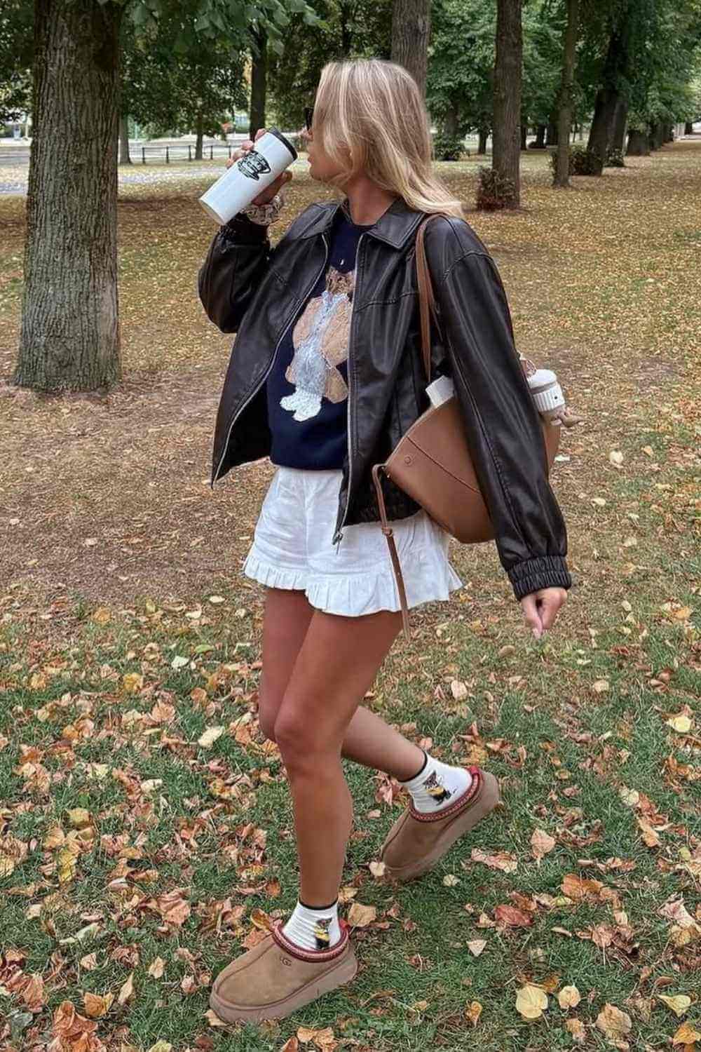 brown leather bomber with ruffle shorts and ugg tazz