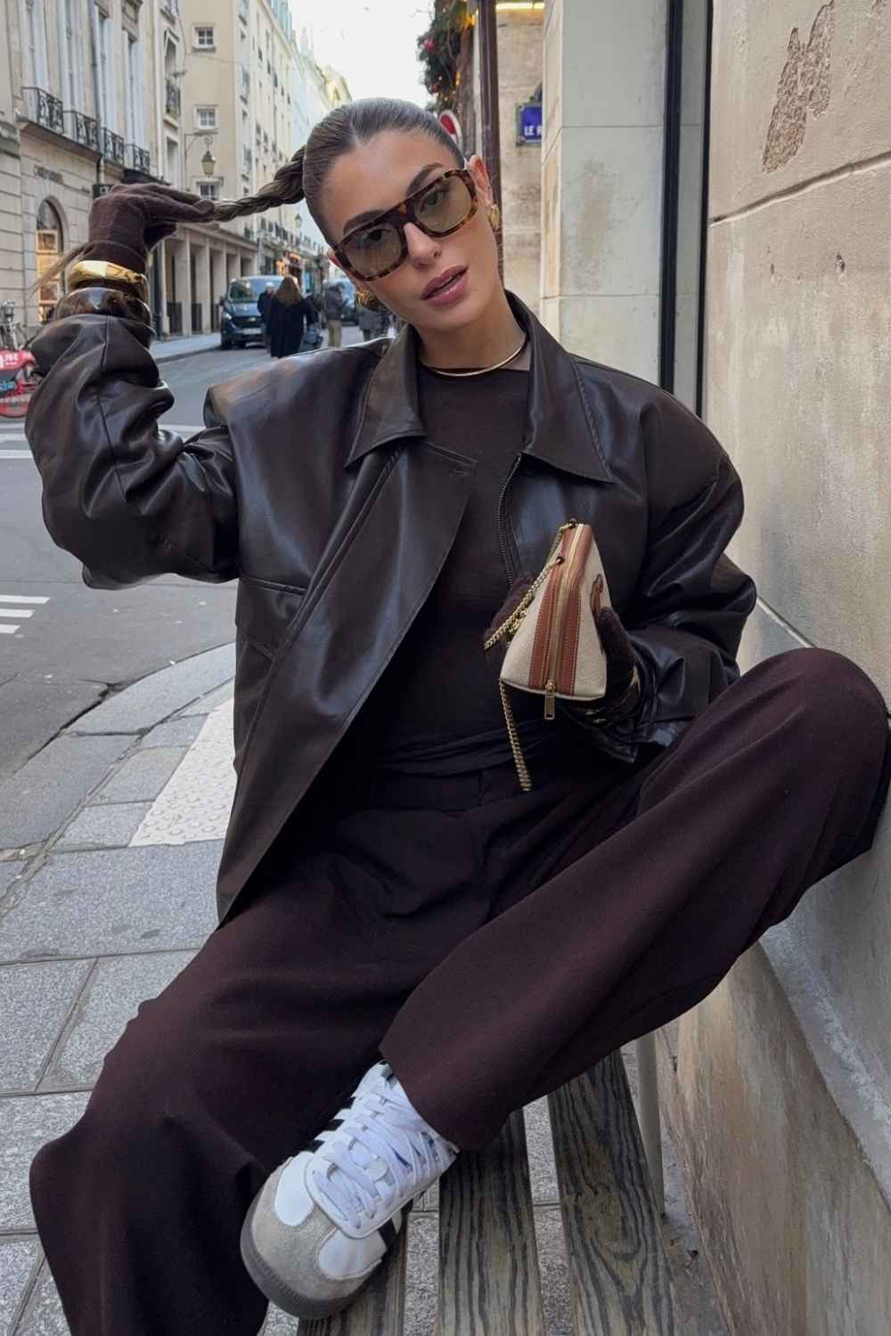 brown leather jacket with trousers and sneakers