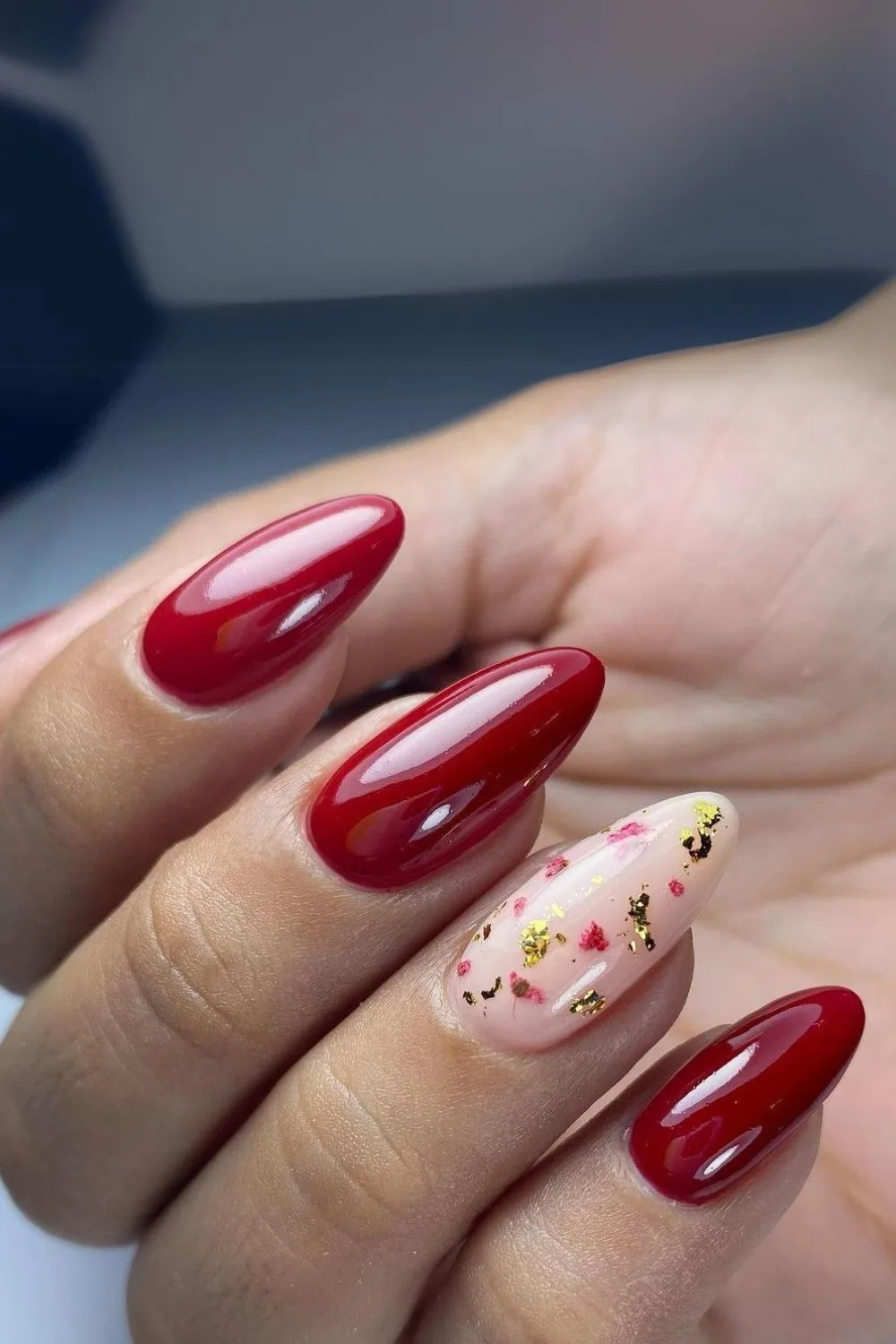 golden accents and deep red nails