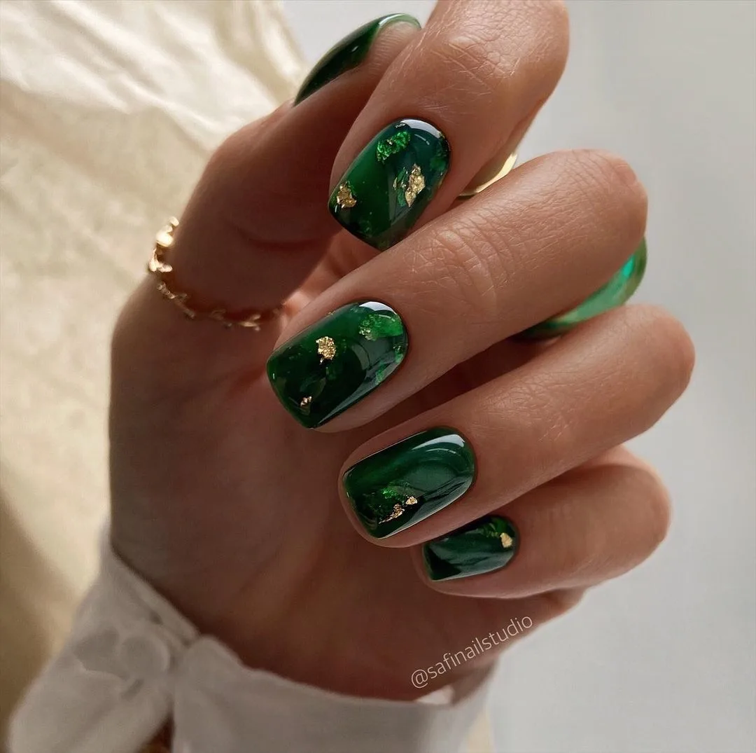 green nails with gold accents