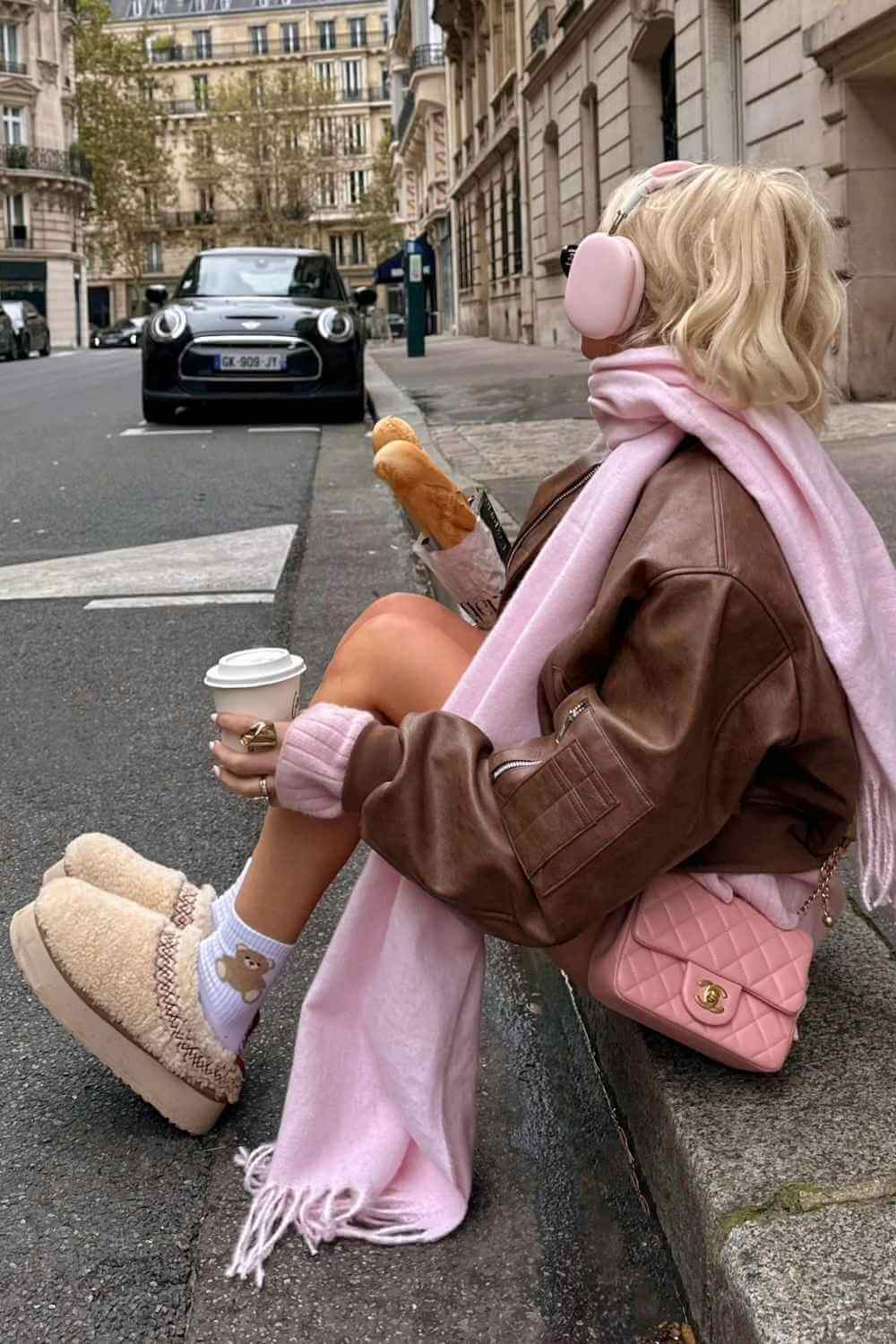 pink scarf with brown bomber and shearling platform slippers