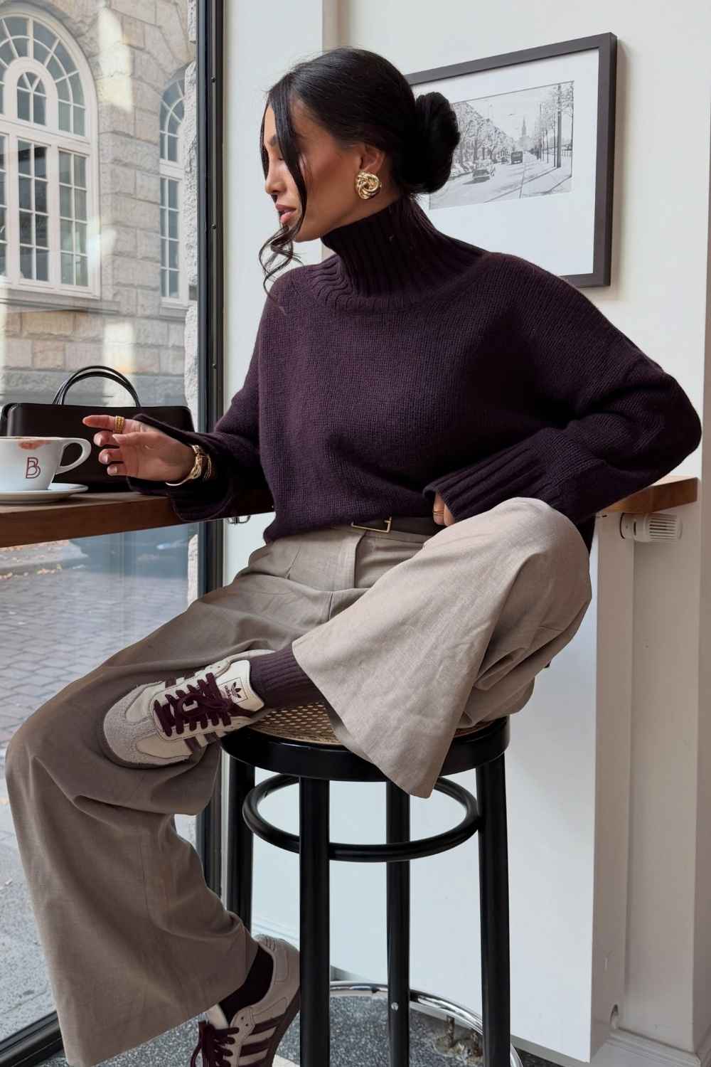 plum turtleneck sweater with wide leg trousers
