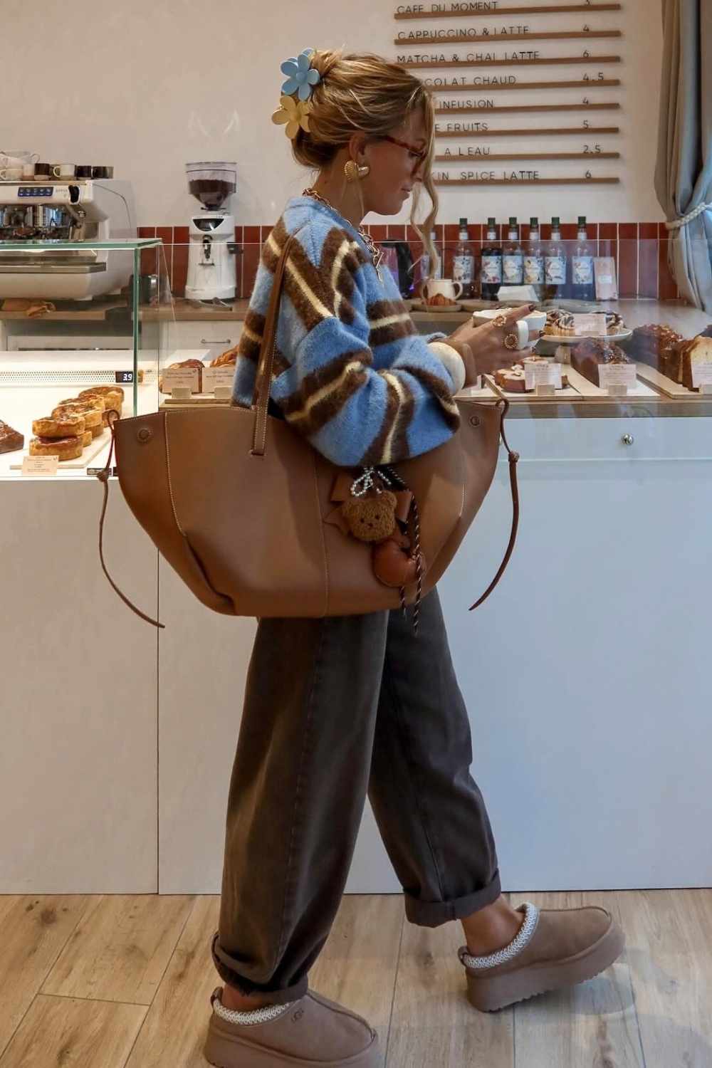 striped mohair sweater with brown trousers and ugg tazz