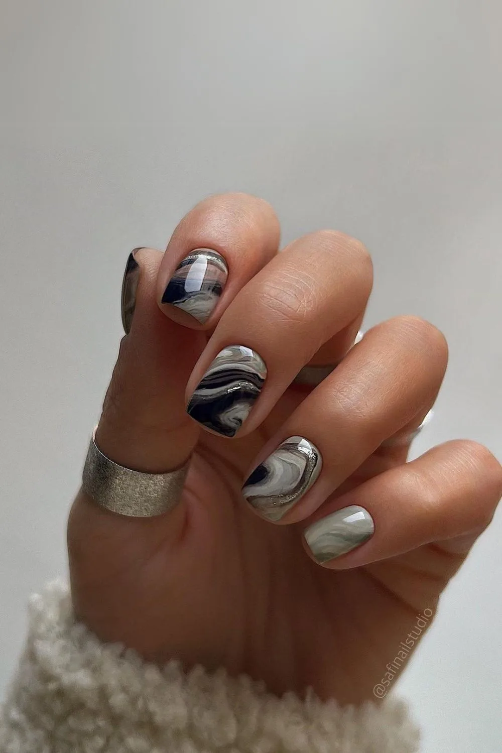 Black and gray marble nails with silver accents