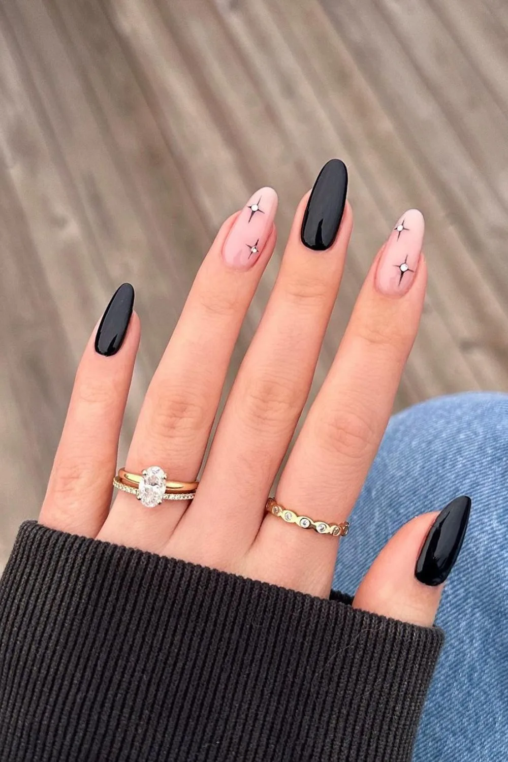 Black manicure with celestial accents