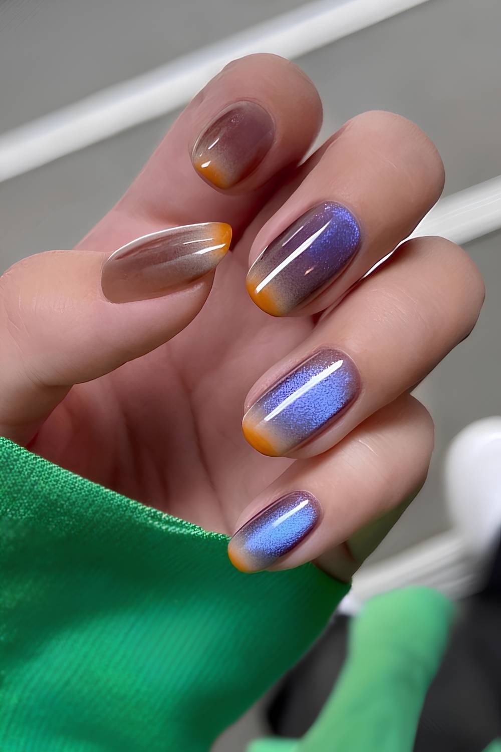 Blue and brown cat-eye manicure