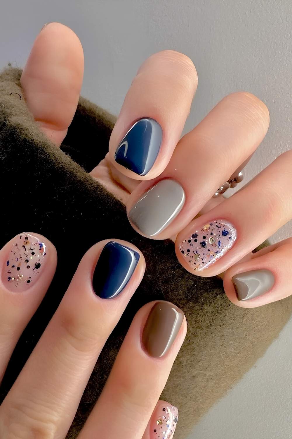 Blue and brown mani with glitter accents