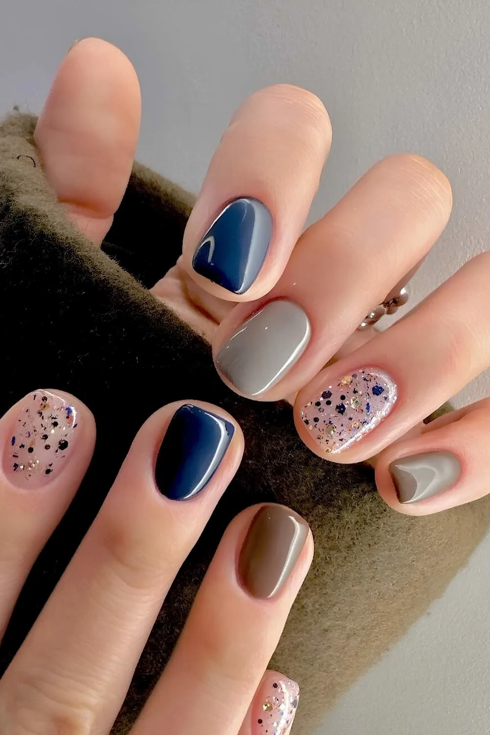 Blue and brown mani with glitter accents