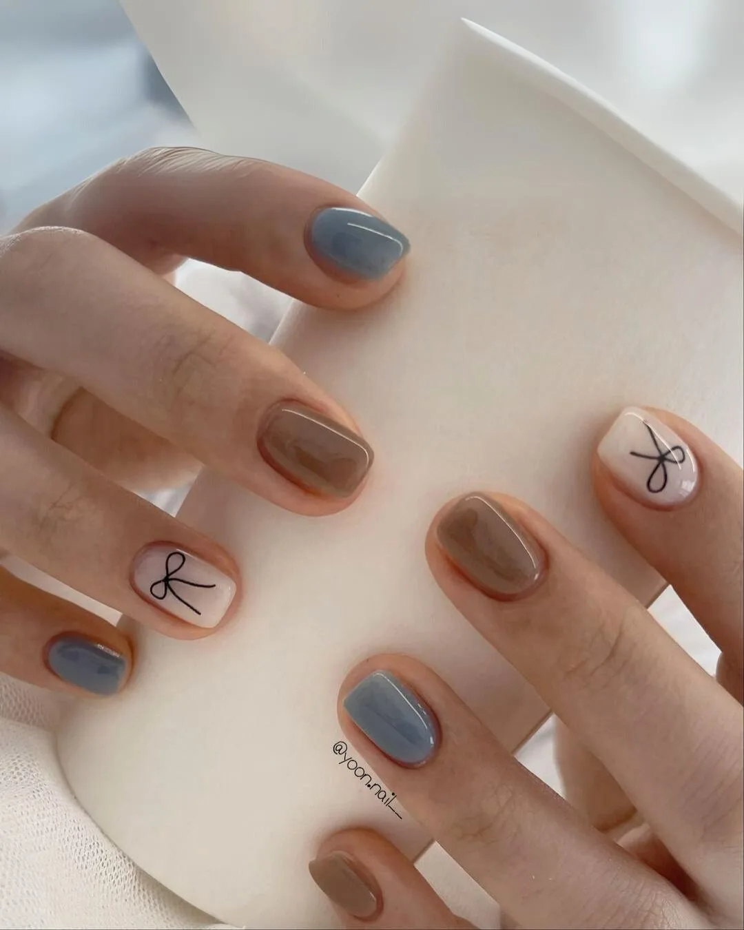 Blue and light brown coquette nails