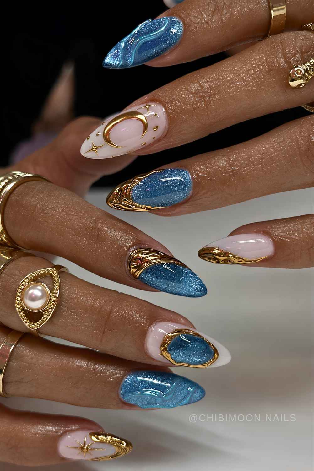 Blue cat eye mani with gold celestial art