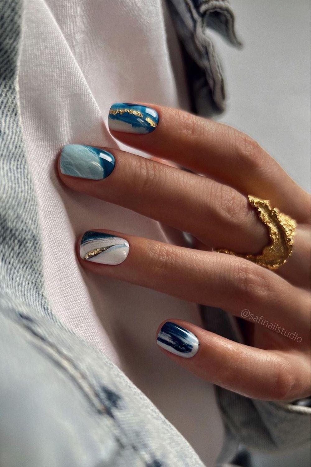 Blue manicure with abstract design