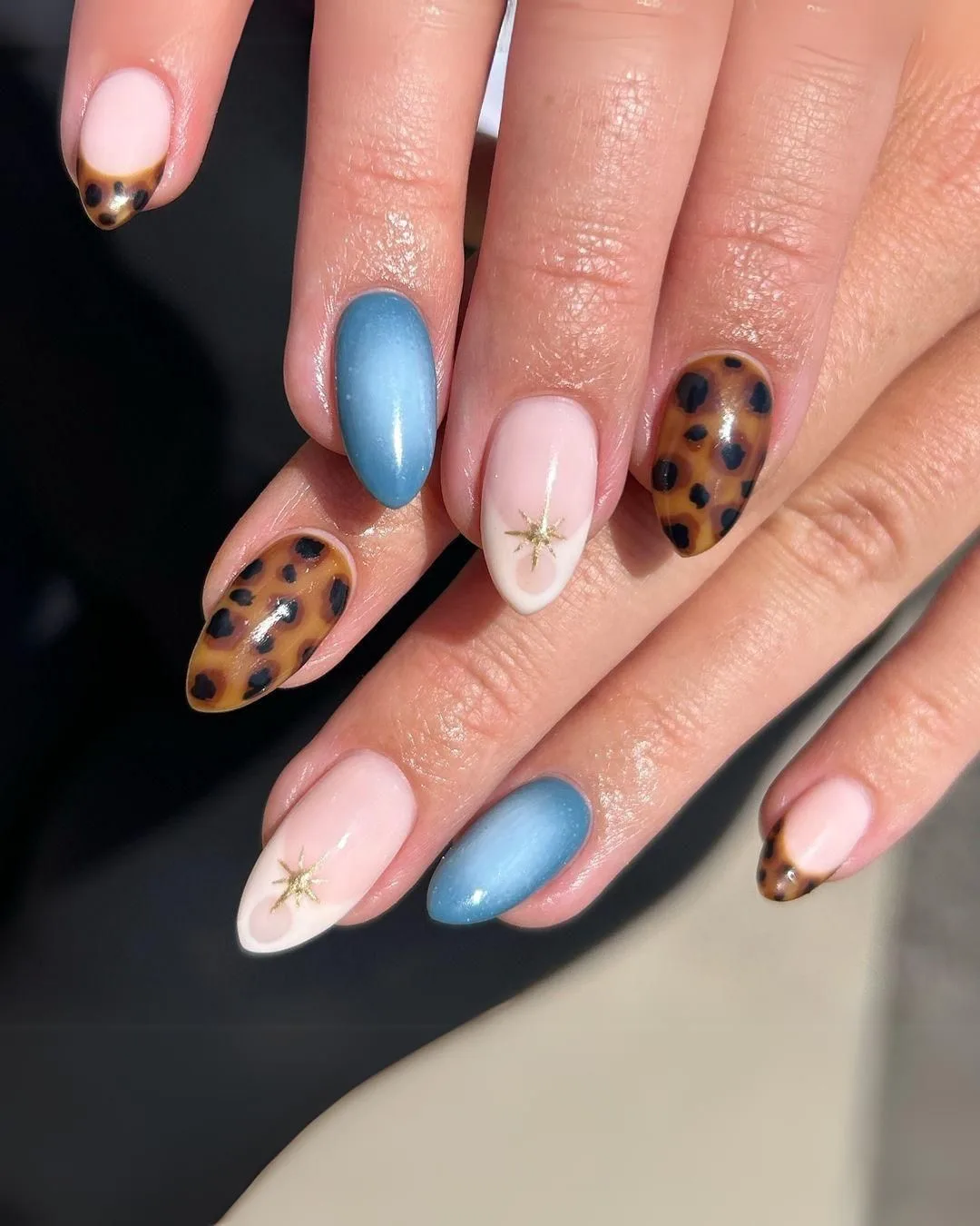 Blue nails with tortoise shell design