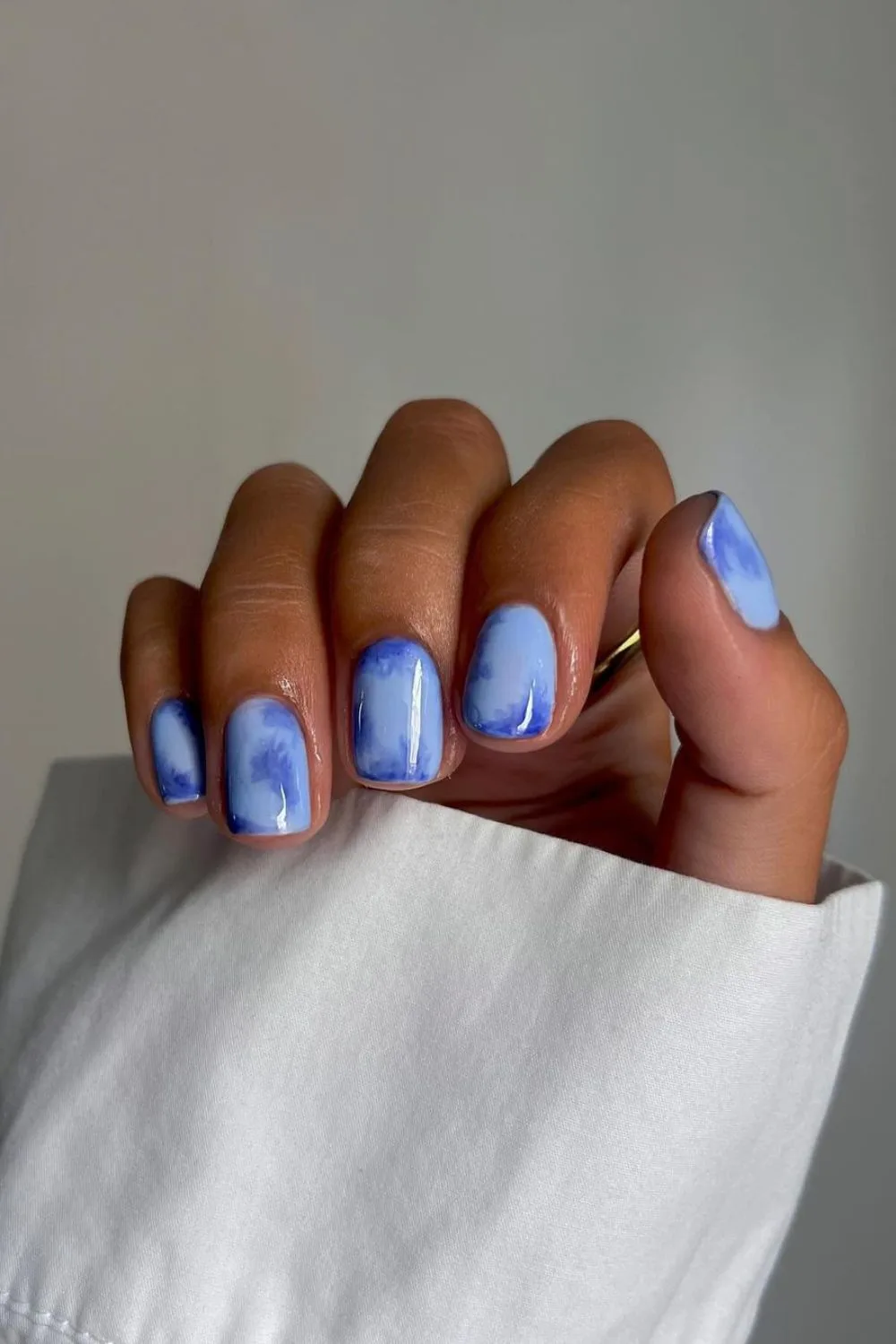 Blue watercolor-effect nails