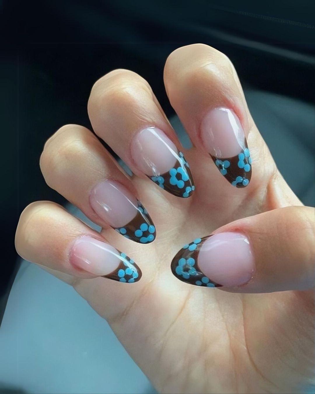 Brown French nails with blue flowers