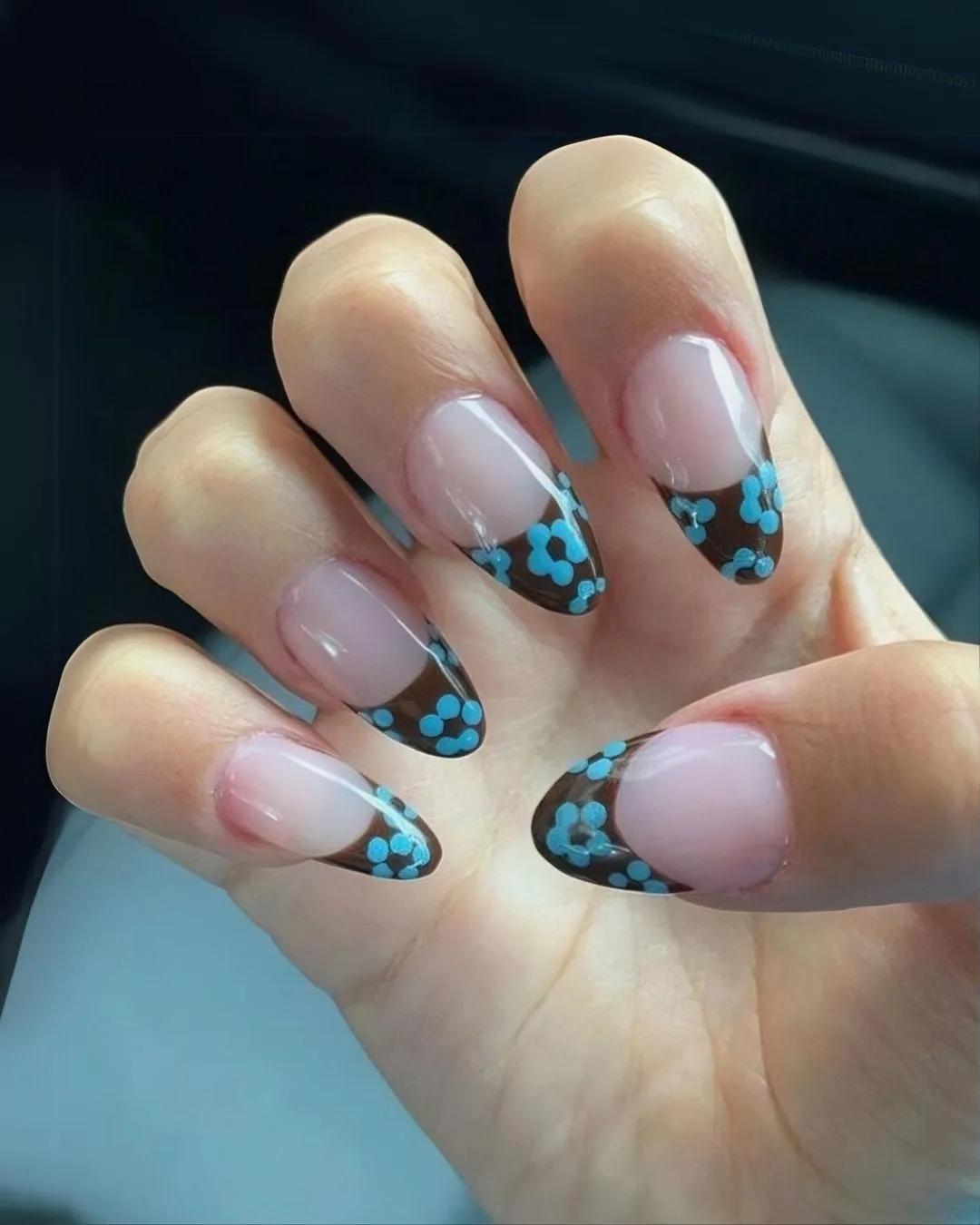 Brown French nails with blue flowers