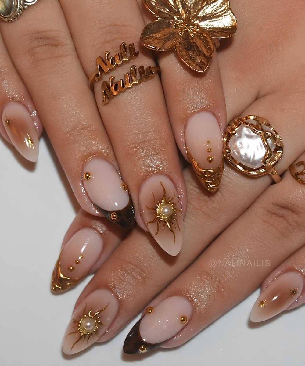 Brown and gold French mani with aura and celestial art