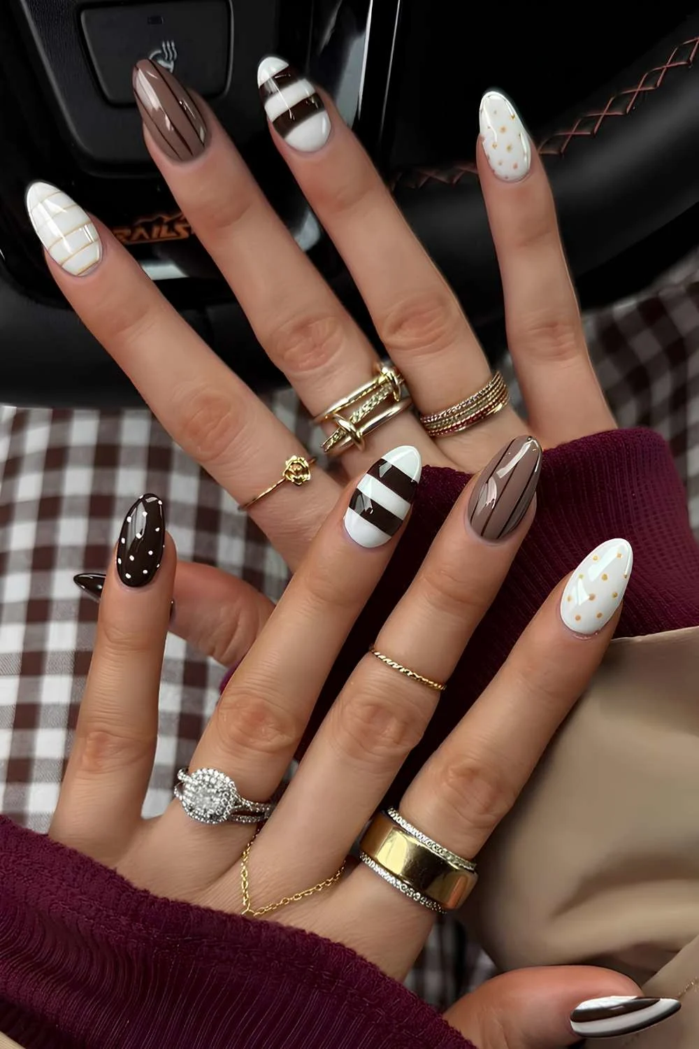 Brown and white nails with stripes and polka dots