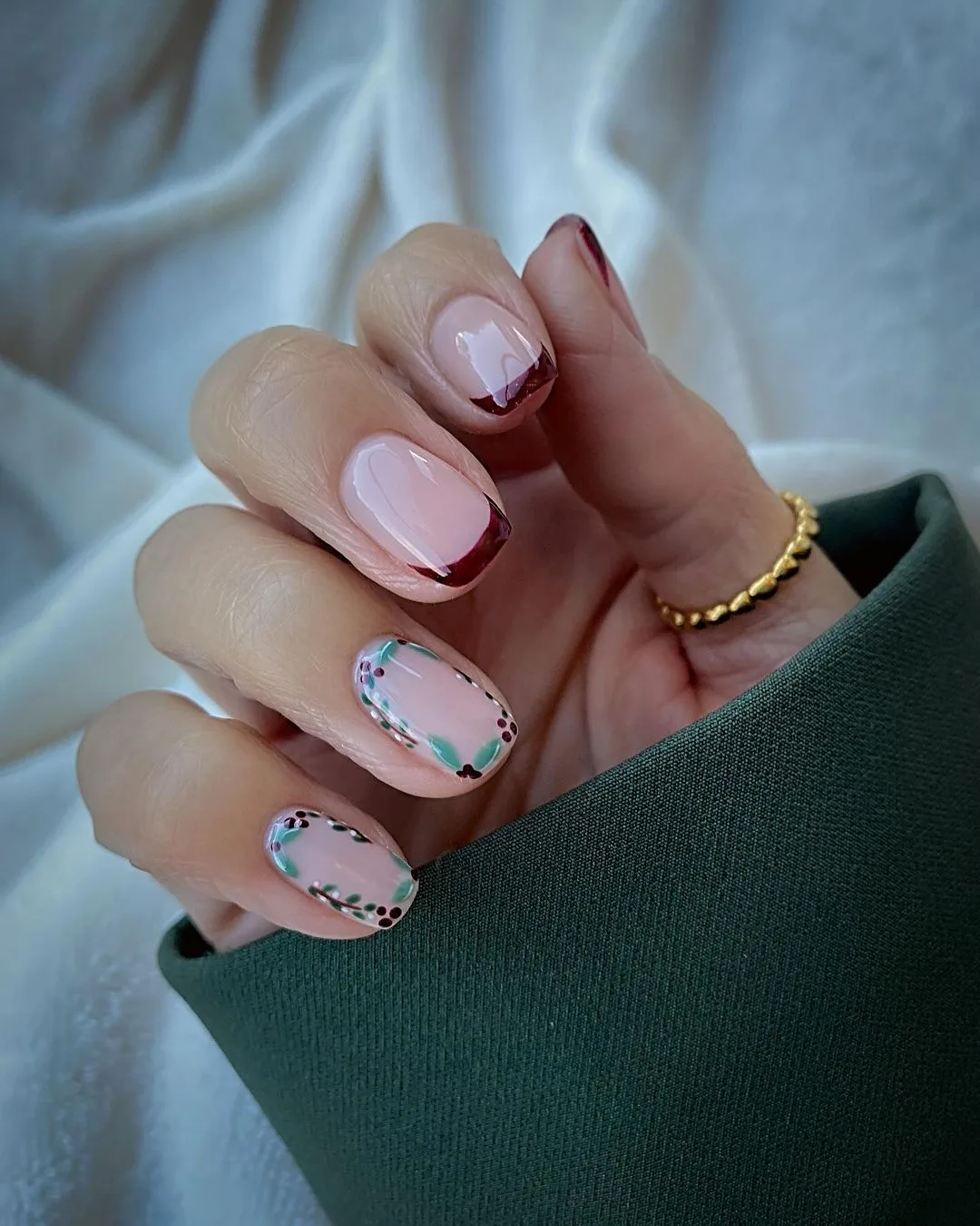 Burgundy French tips with holly accent nails