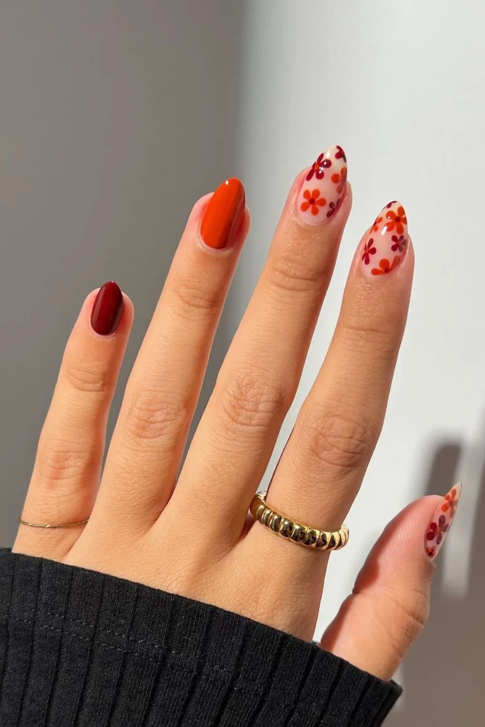 Burgundy and dark orange floral nails