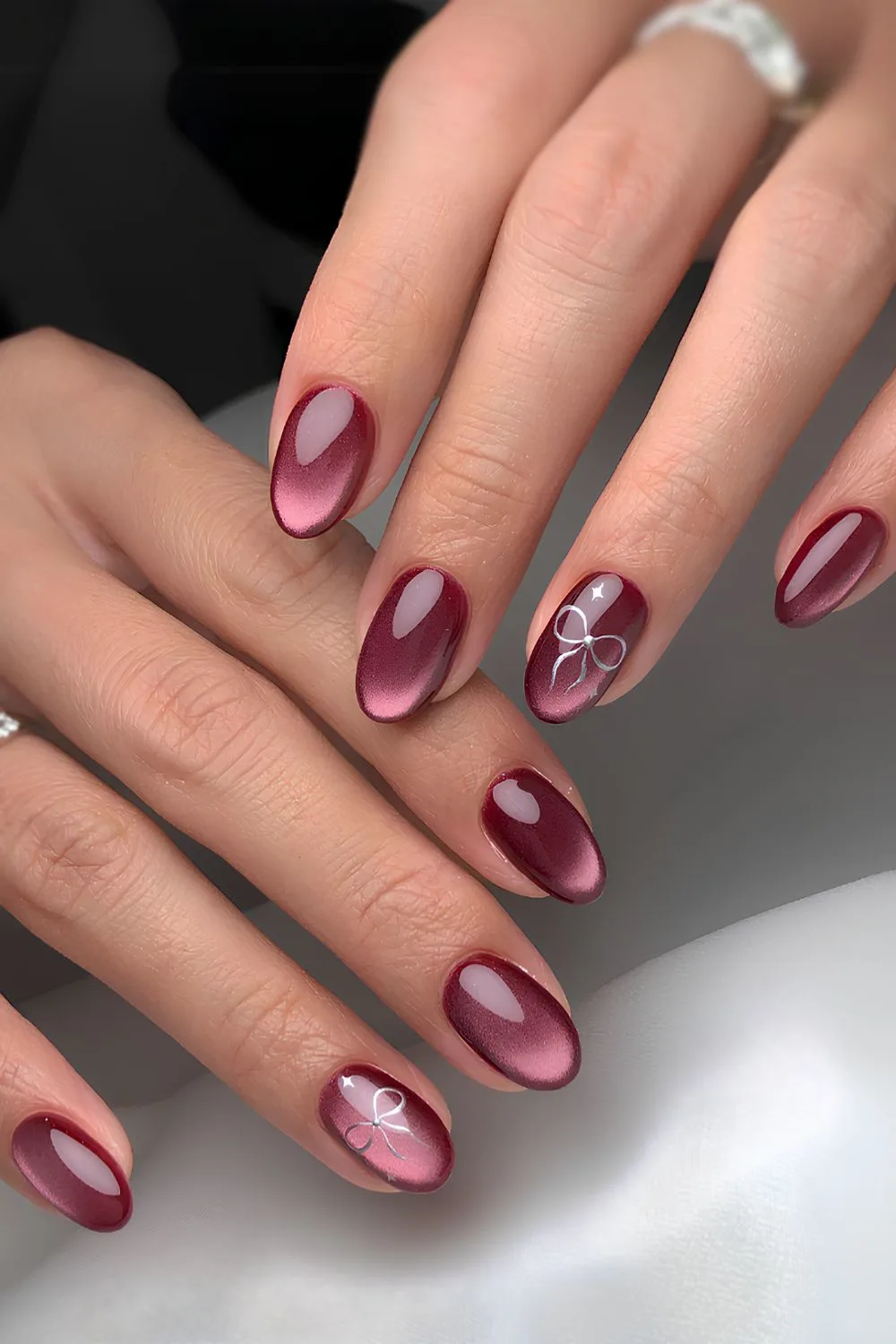 Burgundy glass-effect mani with bows