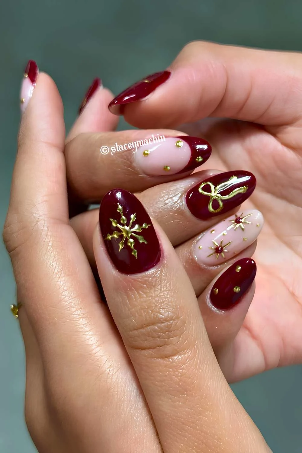 https://thepinkissue.com/wp-content/uploads/2024/10/Burgundy-nails-with-gold-Christmas-themed-art.jpg.webp?utm_source=chatgpt.com