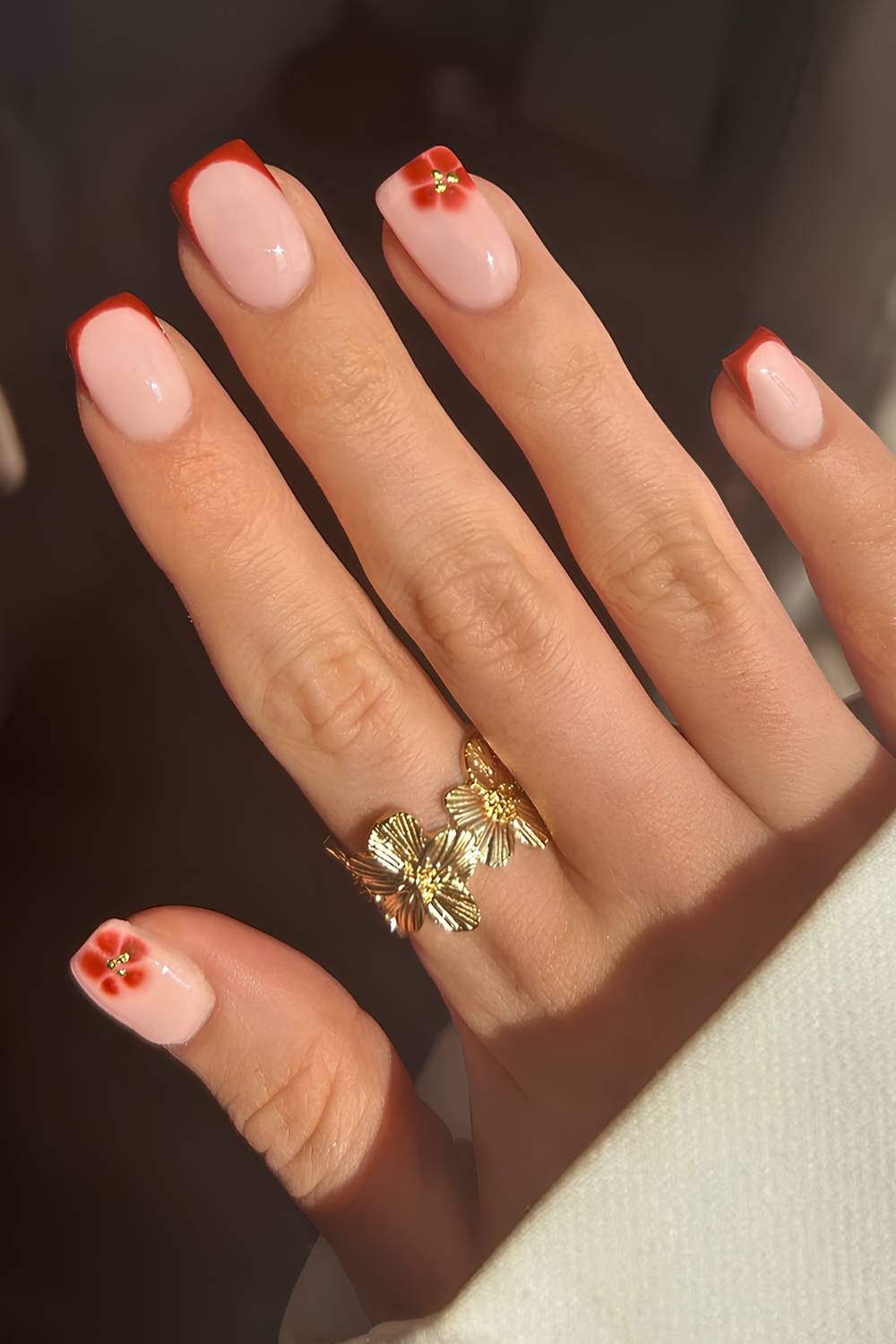 Burnt orange French mani with blooming gel flowers