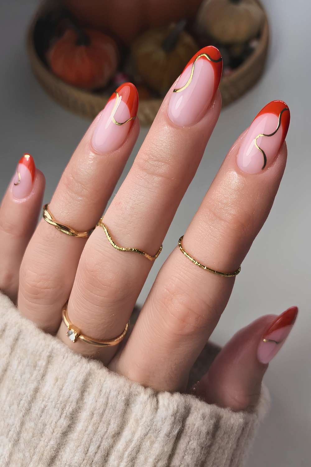 Burnt orange French mani with gold swirls