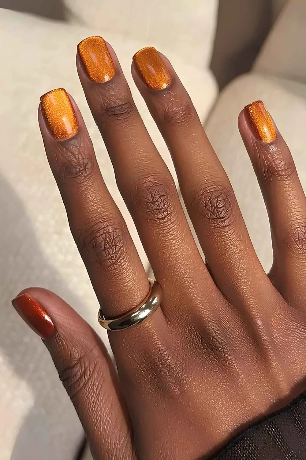 Burnt orange cat eye manicure