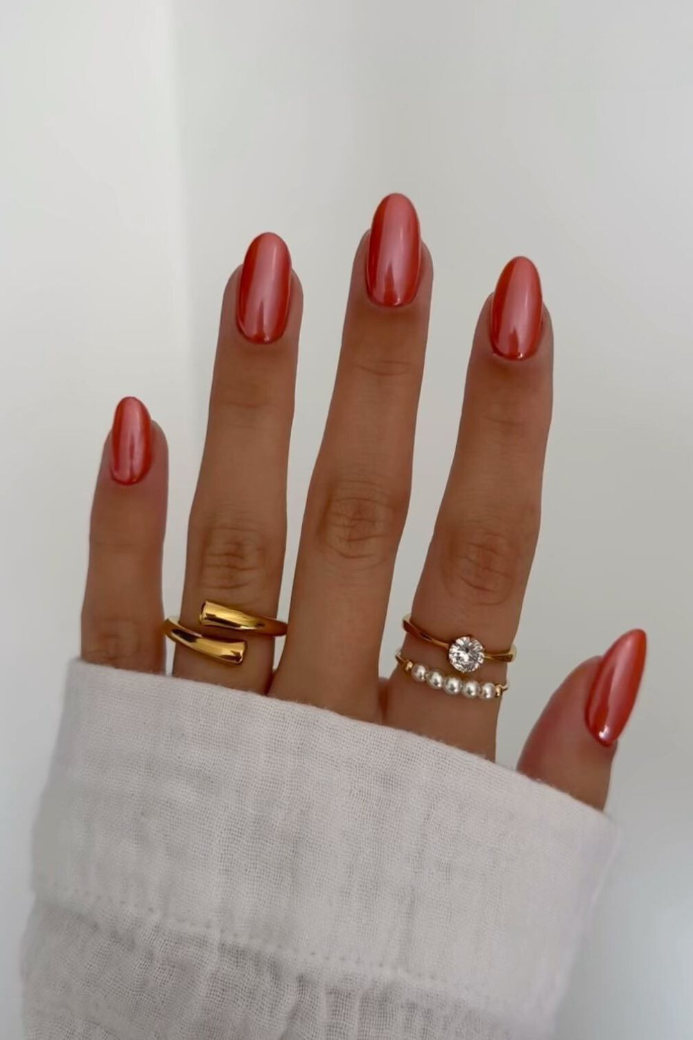 Burnt orange chrome-effect mani